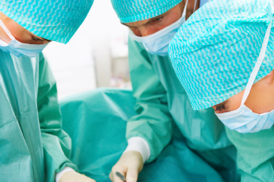 Group of surgeons doing operation in hospital