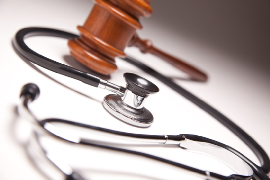 Gavel and Stethoscope on Gradated Background