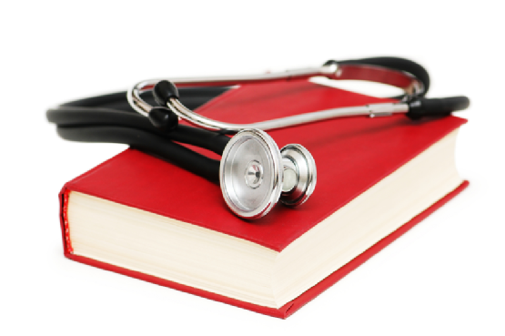 Stethoscope and book isolated on white
